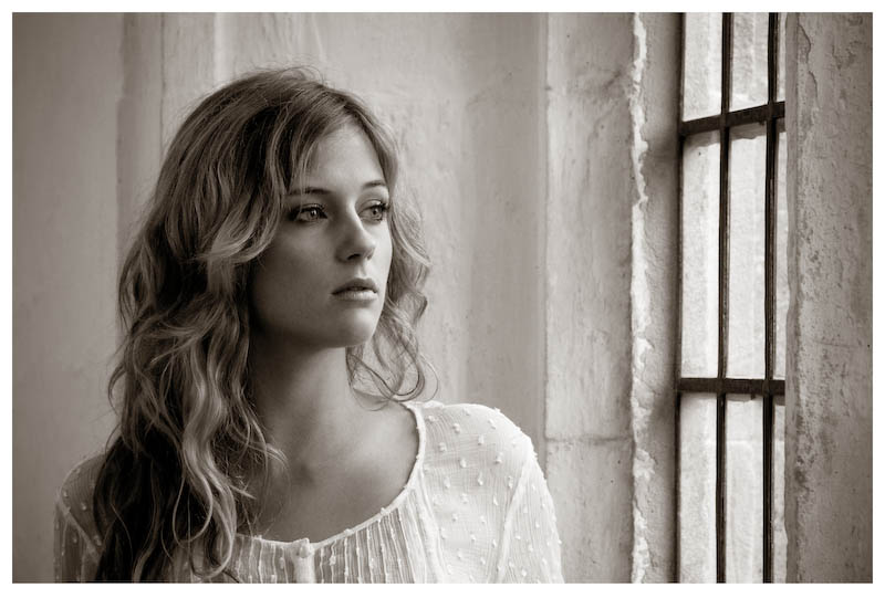 Black and white anatomy of a photoshoot example photograph of a girl looking pensive